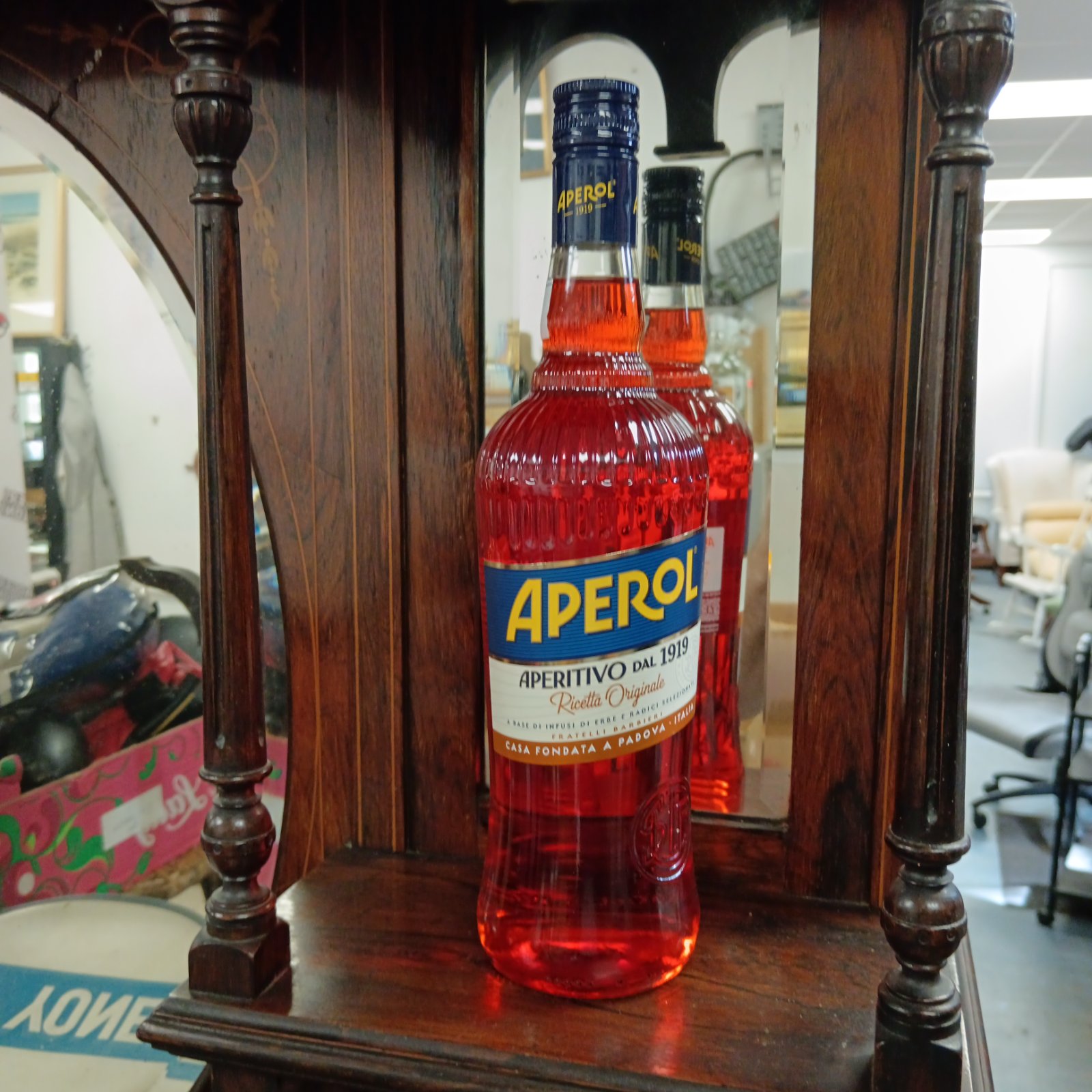 Sealed Aperol bottle from 1919 with original recipe inscription.