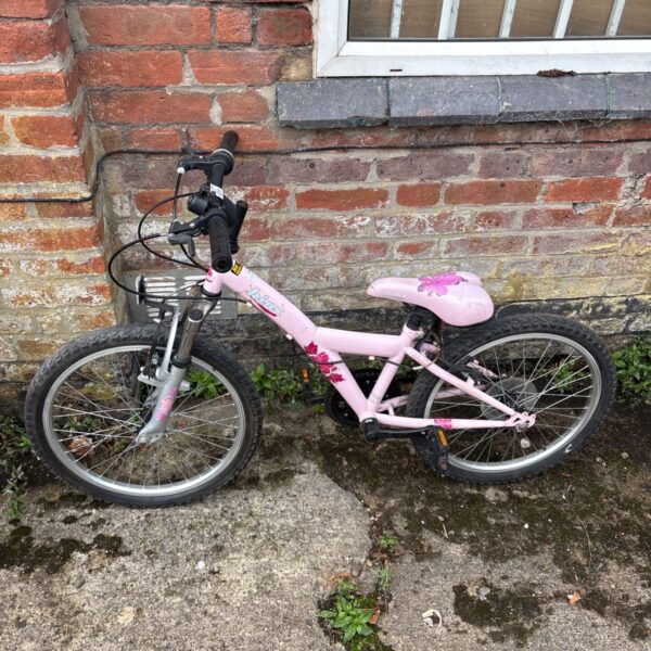 Pink Apollo Kinx junior hybrid bike, suitable for young riders.