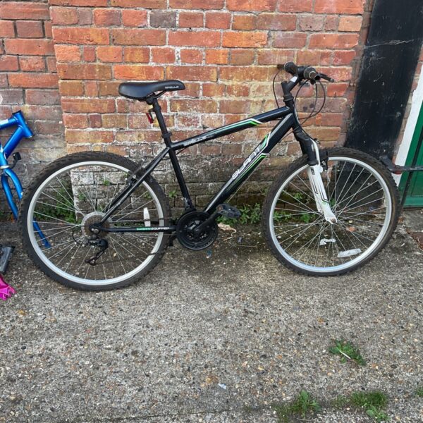Black and green Apollo Slant mountain bike for sale.
