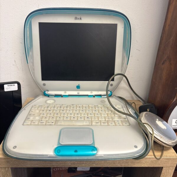 Blueberry Apple iBook G3 Clamshell laptop with charger.