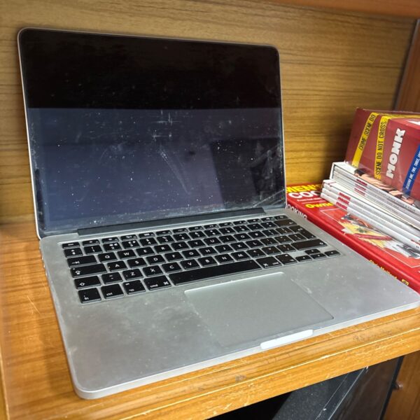 Damaged Apple MacBook Pro A1502 laptop for parts or collection.