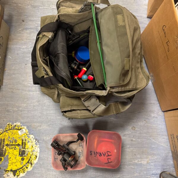 Packed fishing tackle bag with Aqua Products branding and Silstar reels.