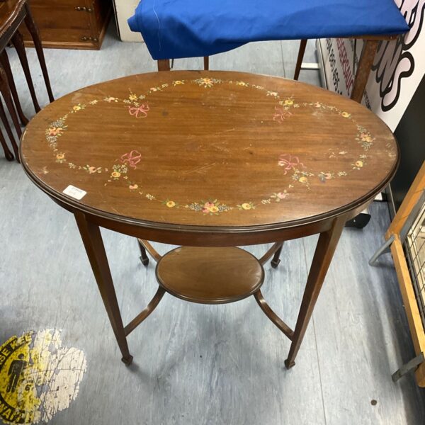 Antique Arts and Crafts mahogany table with inlaid details.