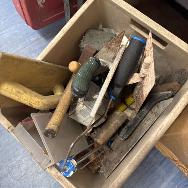 Assorted hand tools in a box, ideal for garden or DIY projects.