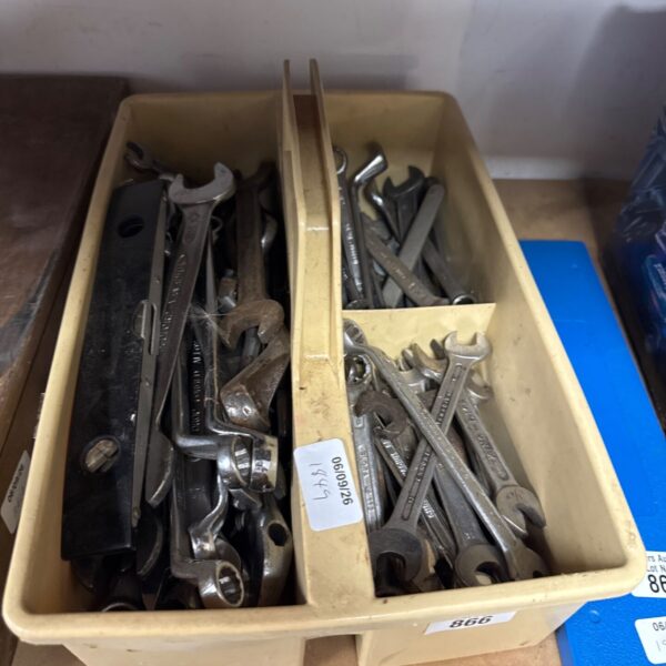 Assorted vintage spanners and spirit level in a tool lot.
