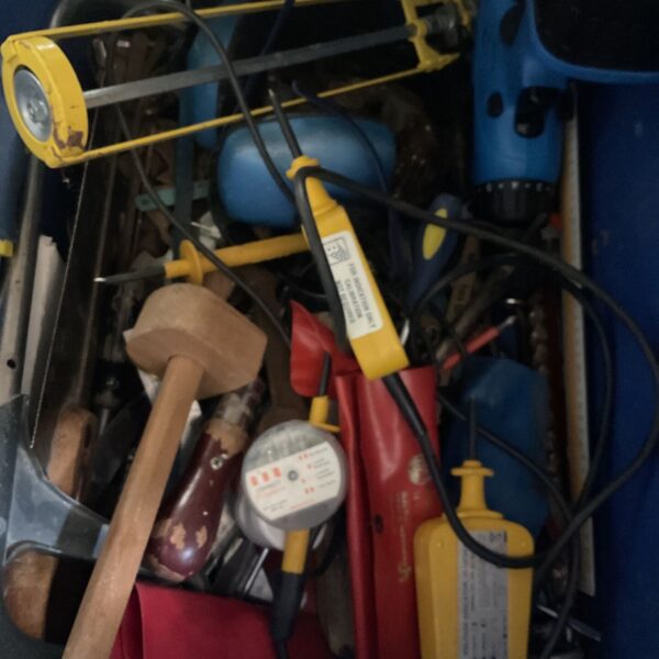 Assorted tool lot including a cordless drill and hammer.