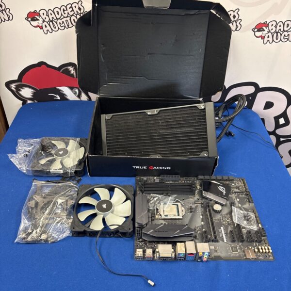 Computer components lot including ASUS motherboard and Corsair cooler.
