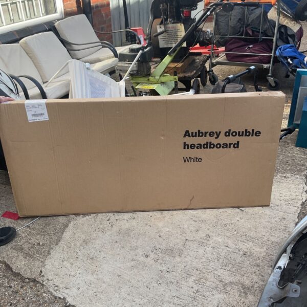 Packaged Aubrey double white headboard ready for auction.