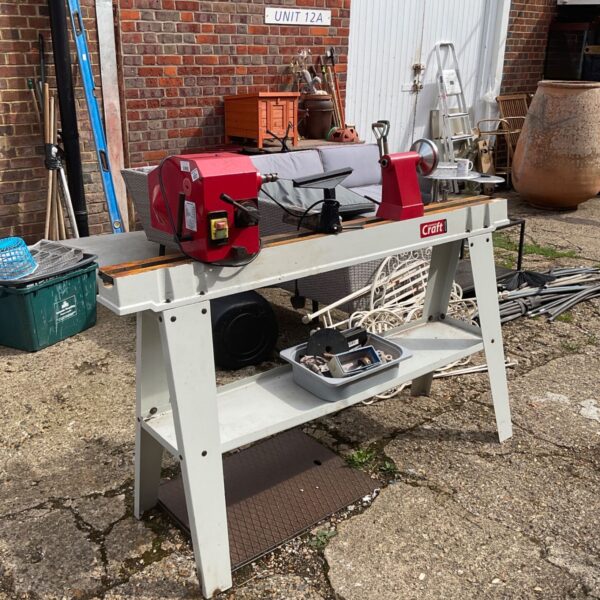 Axminster Craft AL1000 lathe on stand in workshop setting.