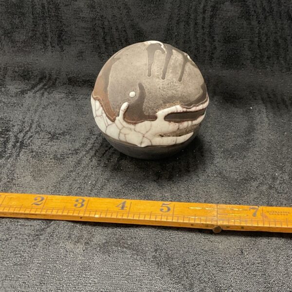 Babs Taylor Rivington Studio pottery ceramic ball with mottled glaze.