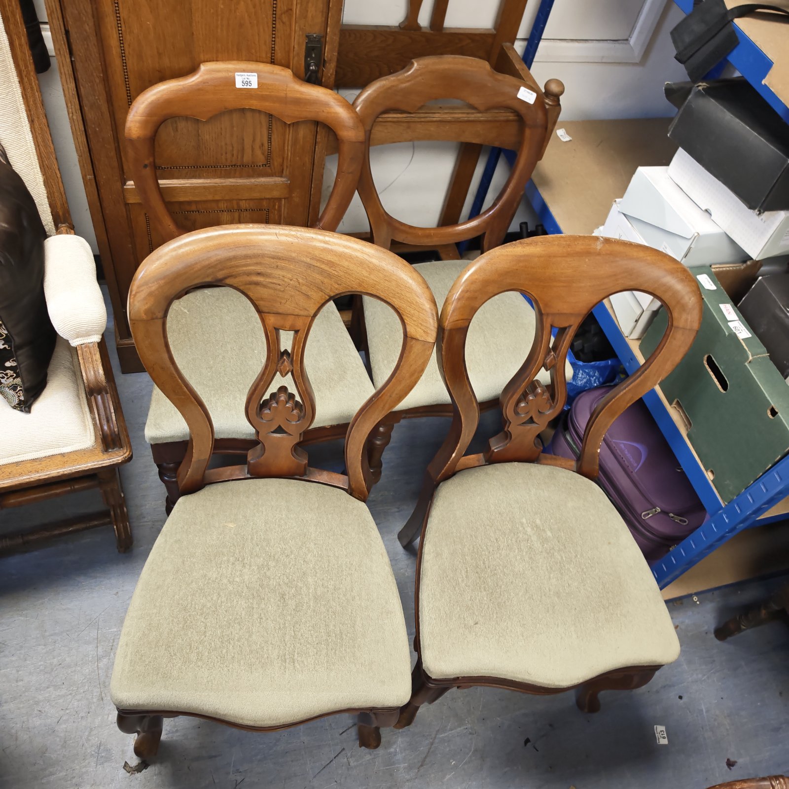 Vintage balloon back dining chairs with green fabric seats.