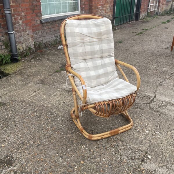 Vintage bamboo conservatory chair with padded seat.