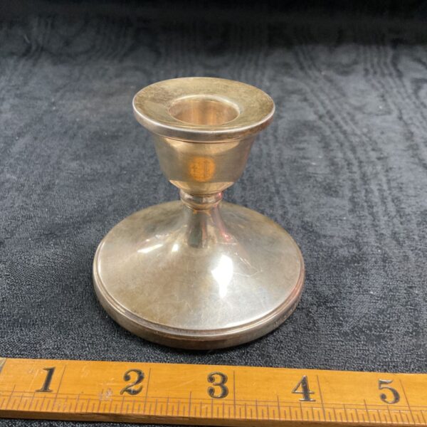 Antique silver candlestick by Barker Ellis with ruler for scale.
