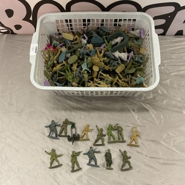 Vintage toy soldiers in a basket, a collectible army men lot.