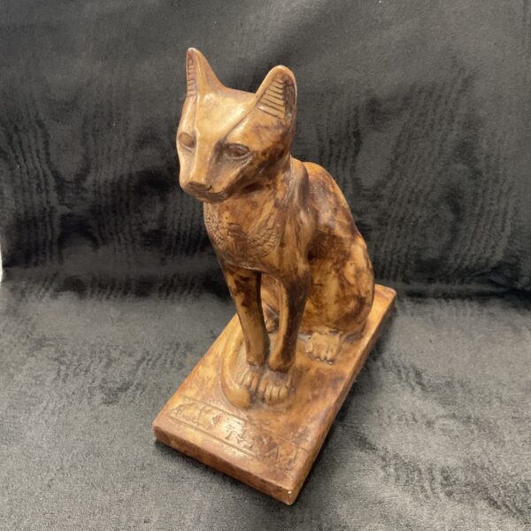 Detailed ceramic Bastet figurine with hieroglyphic base.