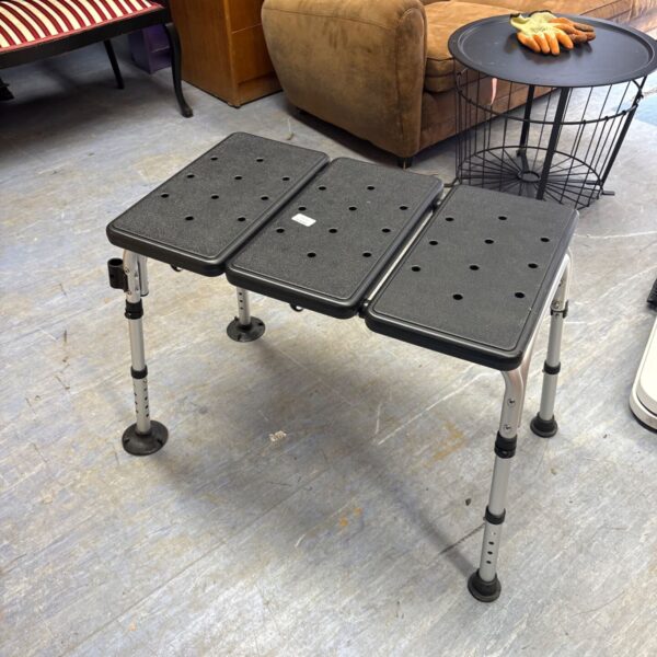 Adjustable bath transfer bench for improved bathroom mobility and safety.