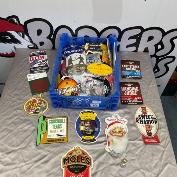 Vintage beer pump head plaques from Marstons and other breweries, collectible pub signs.
