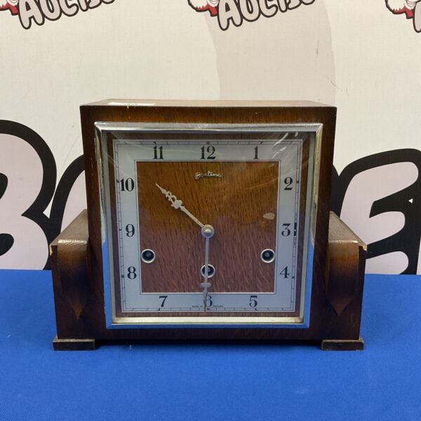Vintage Bentima art deco mantle clock with wooden case and cream face.