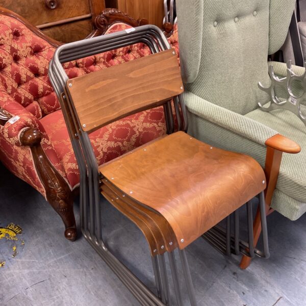 Set of four vintage stackable bentwood chairs with chrome frames.