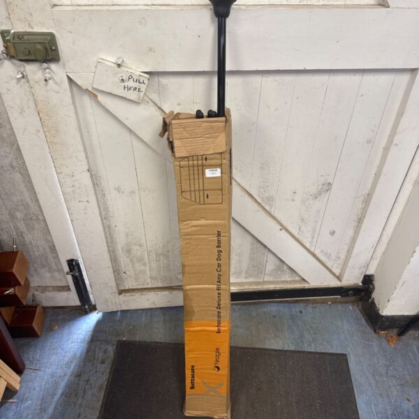 Used Bettacare Yeagle universal car dog guard in packaging.