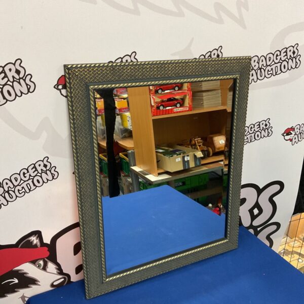 Modern bevel edge mirror with a lattice frame.