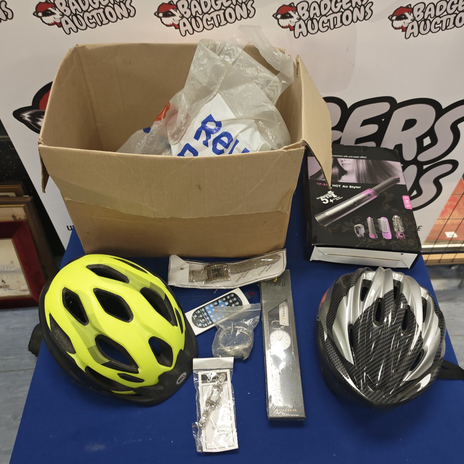 Yellow bicycle helmet in a mixed lot of accessories.