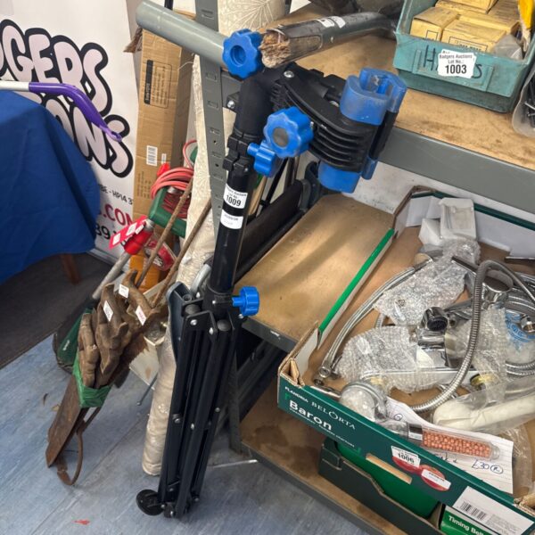 Used bicycle service stand tripod for bike repair and maintenance.