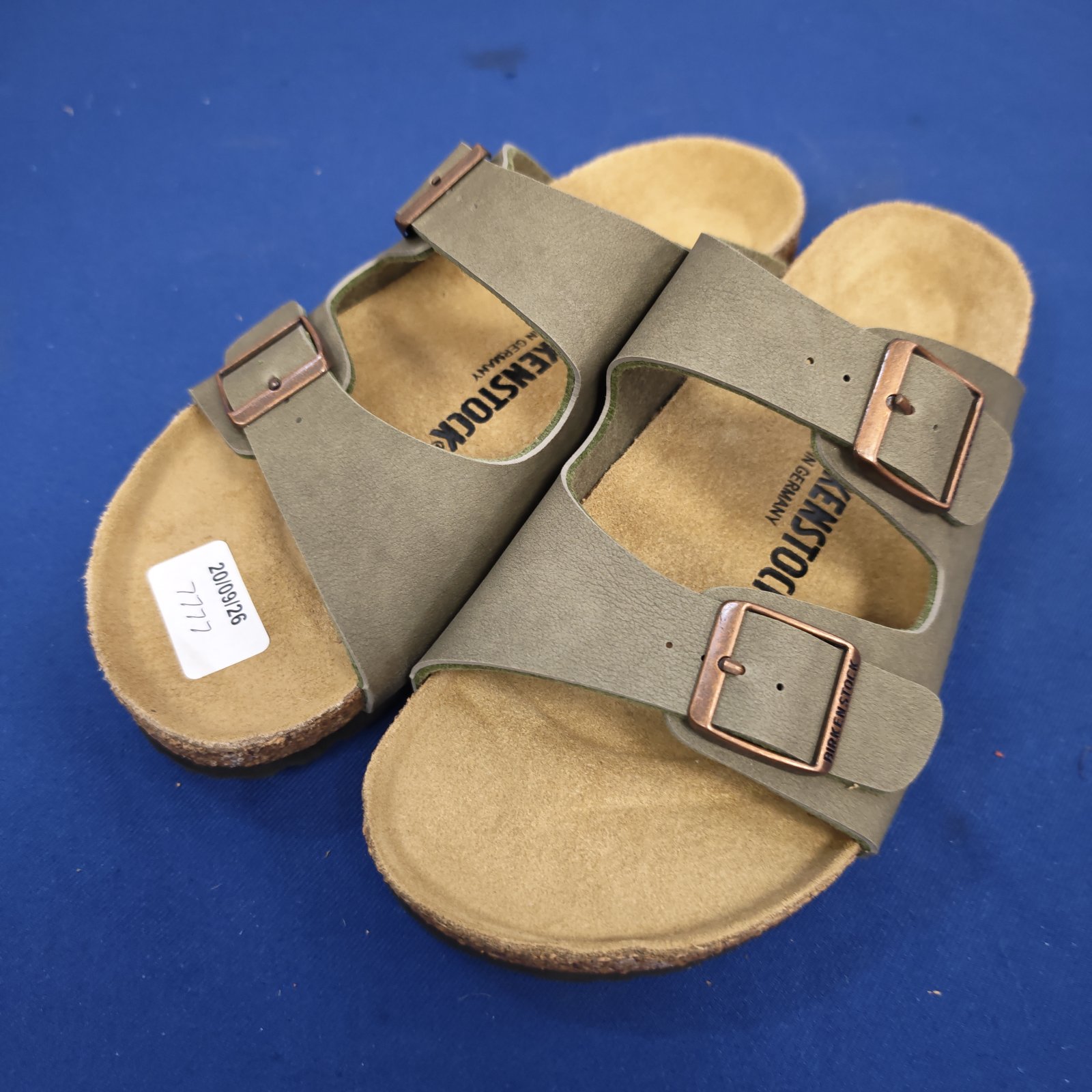 Birkenstock Arizona sandals size 38, showing leather upper and footbed.