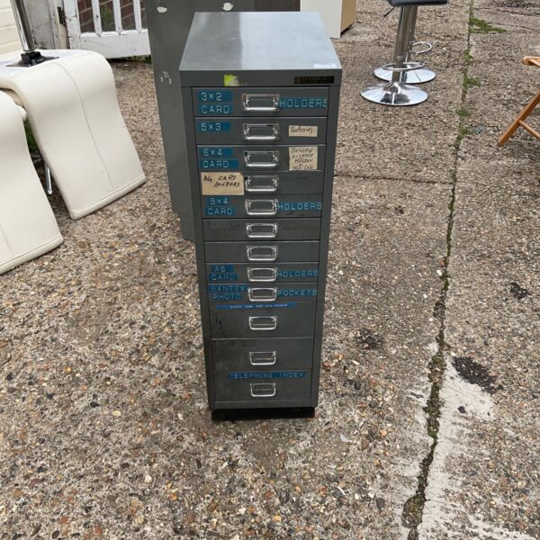 Vintage Bisley metal filing cabinet with multiple drawers.