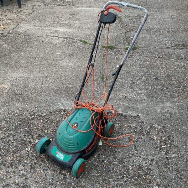 Vintage Black and Decker electric lawnmower in used condition.