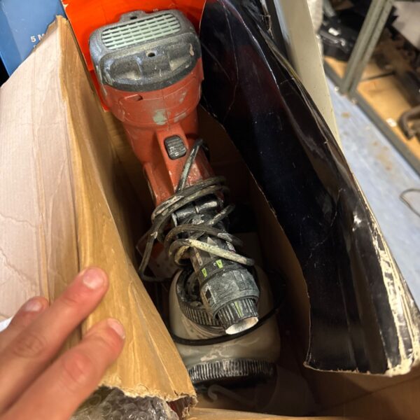 Black & Decker electric paint sprayer in damaged box.