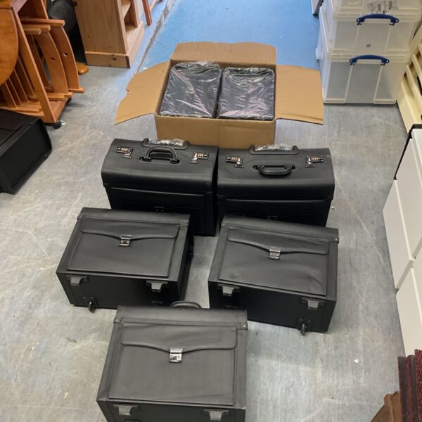 Lot of seven black briefcases for sale.