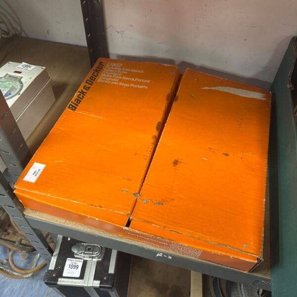 Orange Black & Decker saw bench packaging with model number.