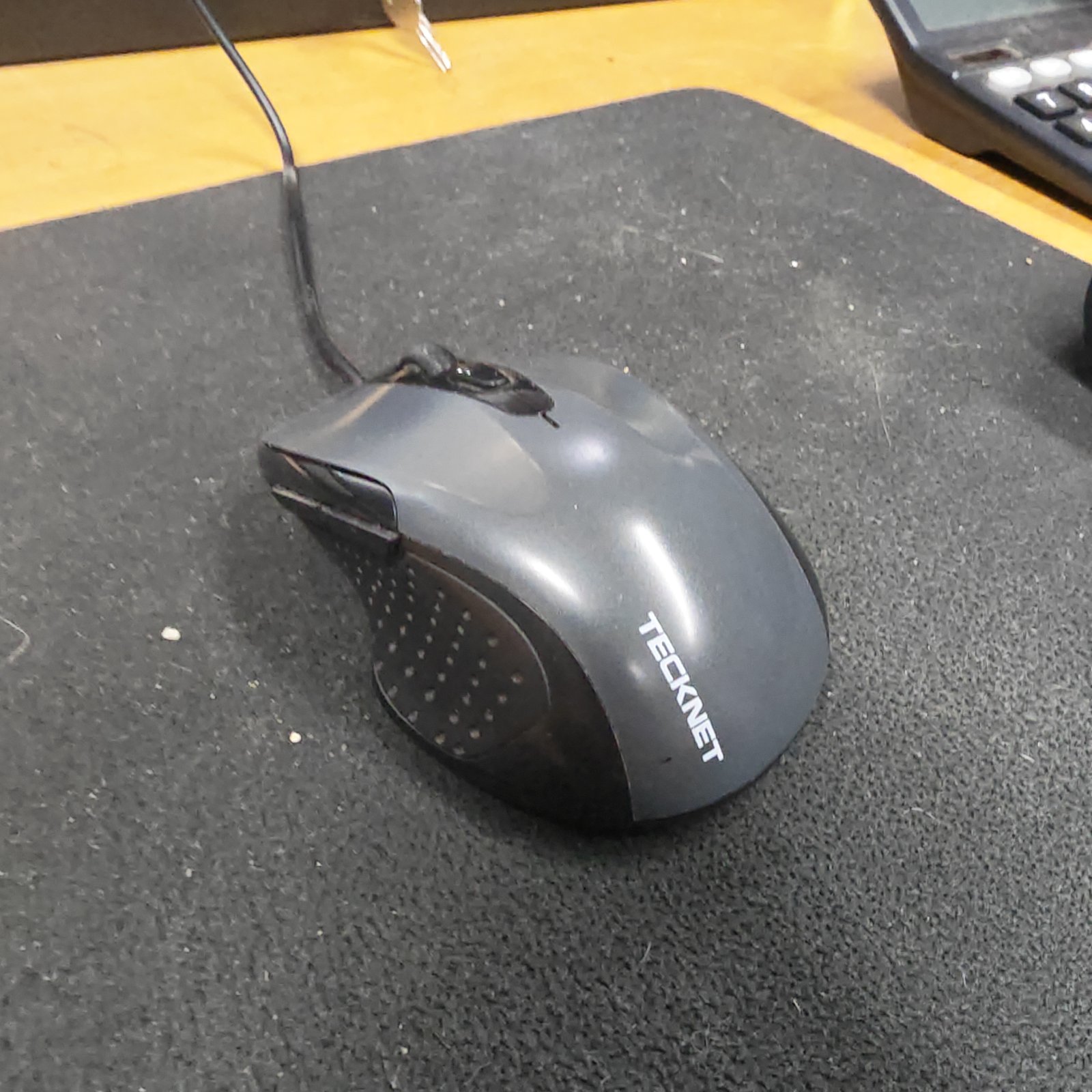 Black wired computer mouse for PC use.