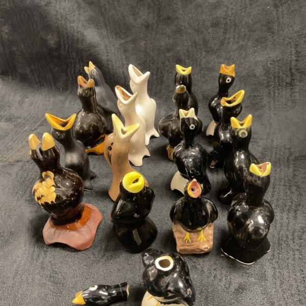 Vintage ceramic blackbird pie funnels displayed as a collectible set.