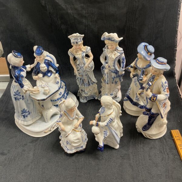 Group of seven antique blue and white porcelain figurines.