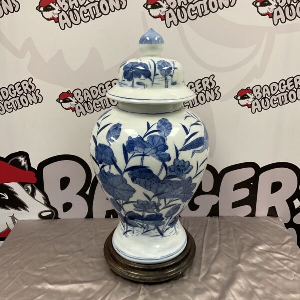 Large blue and white porcelain ginger jar with lotus design.