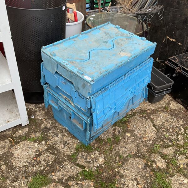Blue plastic storage containers for garage or garden use.