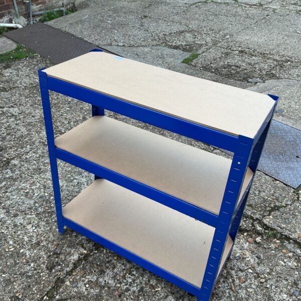 Blue metal shed shelf unit for garage or workshop storage.