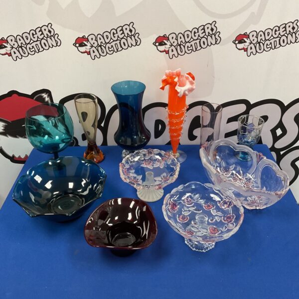 Vibrant bohemian art glass collection featuring an orange vase and blue bowl.