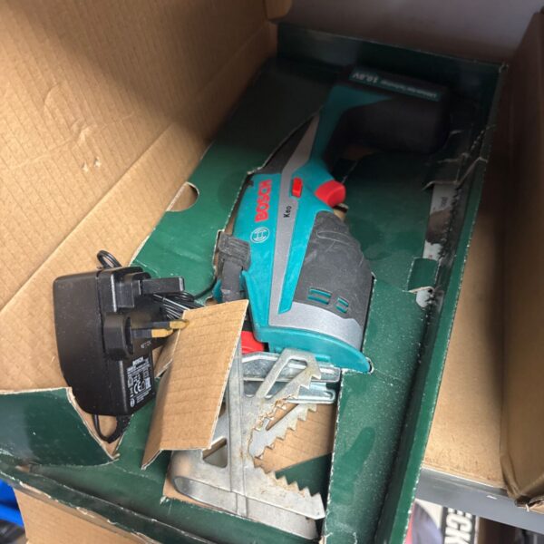 Bosch Keo cordless garden saw with charger in box.
