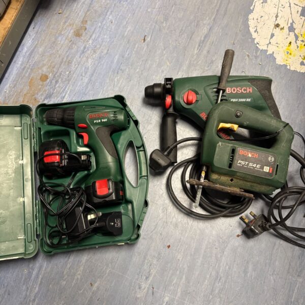 Bosch power tools lot including a cordless drill, jigsaw and PSH 90 drill.