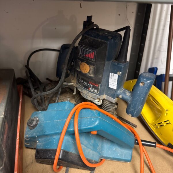 Vintage Bosch router and Black & Decker electric planer for woodworking.