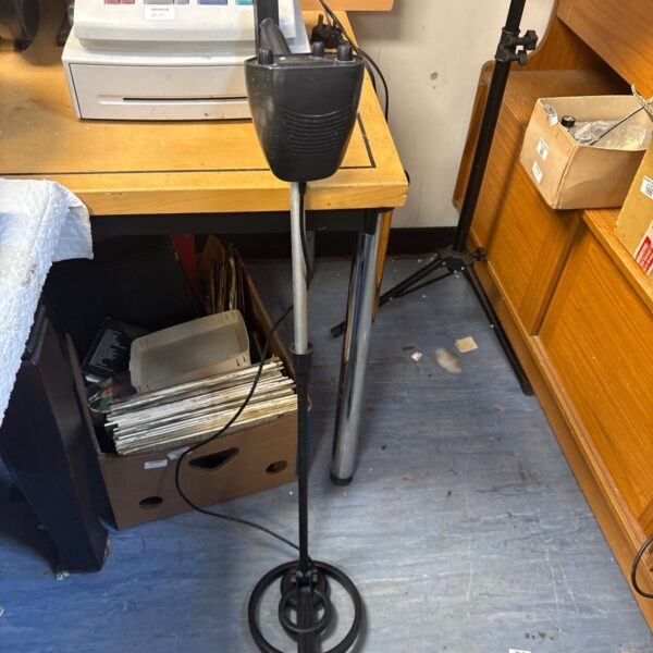 Bounty Hunter metal detector with search coil and adjustable shaft.