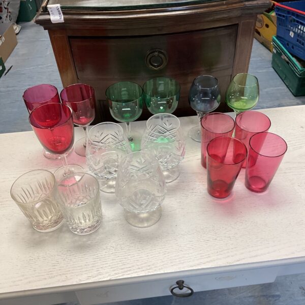 Selection of colourful and cut glass brandy glasses.