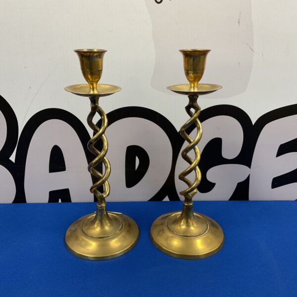 Vintage brass candlesticks with a twist stem design.
