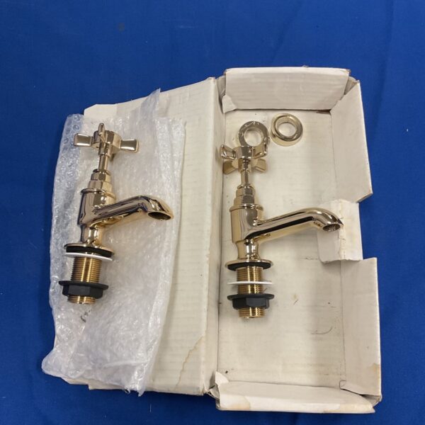 Pair of vintage brass hot and cold taps for bathroom restoration.