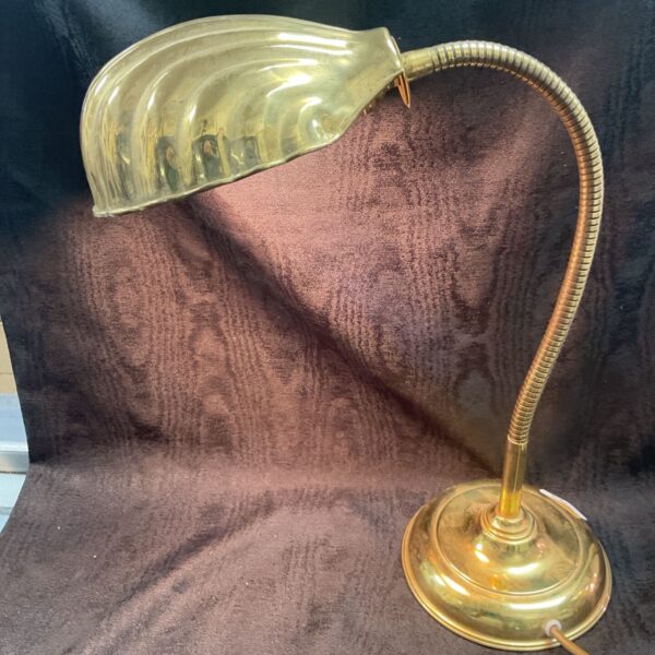 Vintage brass swan neck desk lamp with shell shade.