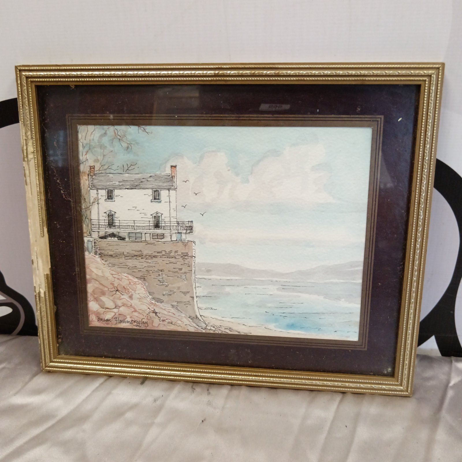 Brian Hammersley watercolour painting of a coastal cottage.