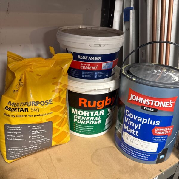 Bundle of building materials including mortar, cement and paint.